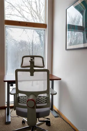 a bedroom with bed and window