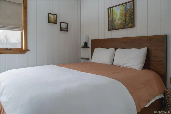 a room with mirror and window