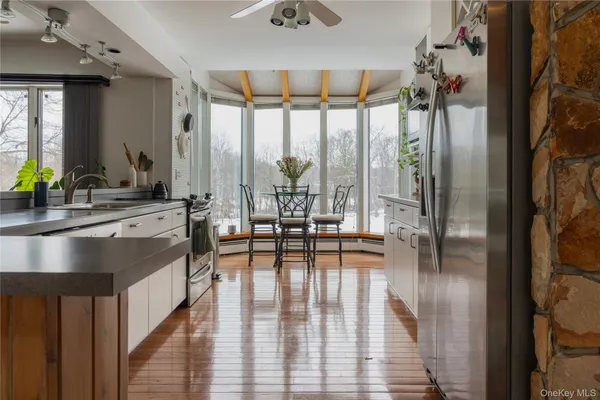 a view of a dining room with furniture window and wooden floor