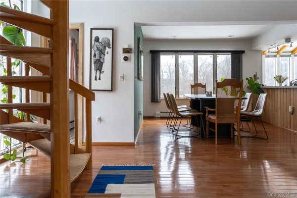 a living room with furniture flat screen tv and a fireplace