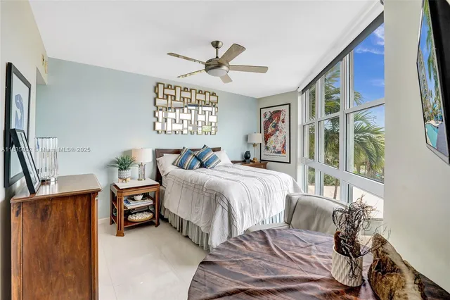 a bathroom with a sink mirror and toilet