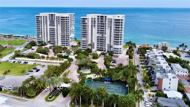 a front view of a building with outdoor space