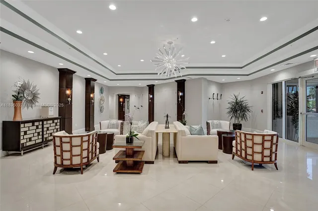 a front view of a building with palm trees