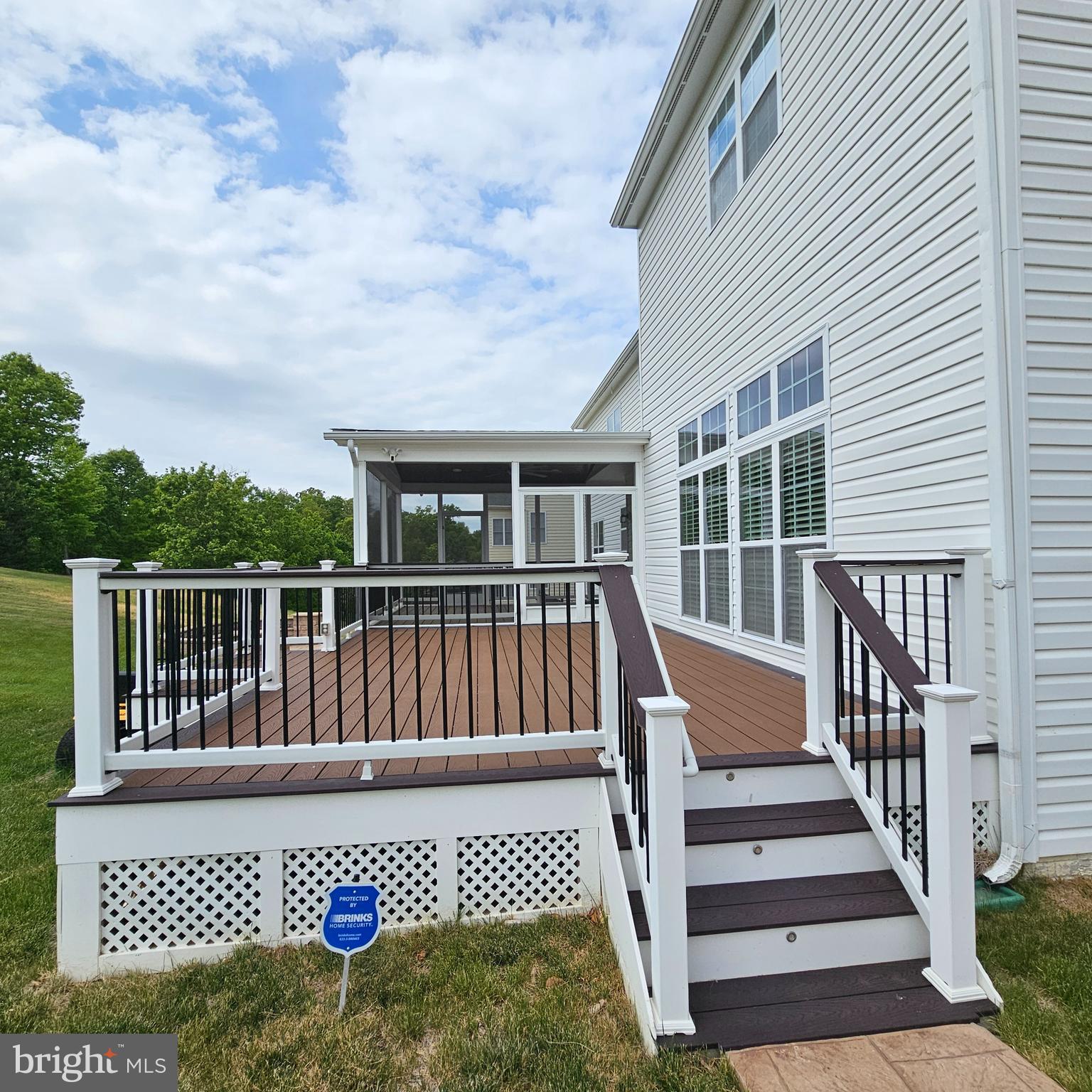 18475 Kerill Road Triangle, VA 22172 - Photo 89 of 99 a view of a wooden deck and a floor to ceiling window
