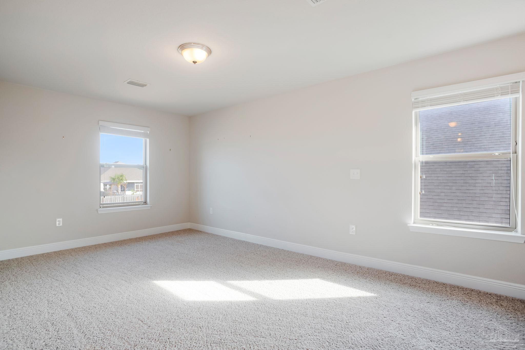 8016 Woodbrook Road Pensacola, FL 32526 - Photo 30 of 52 an empty room with a window