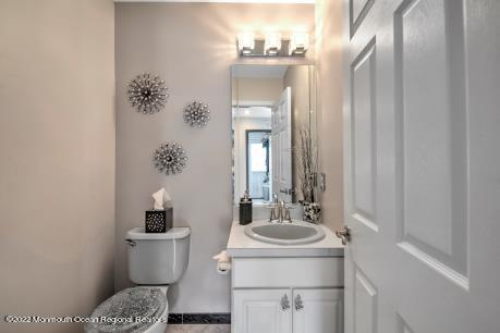 335 Buckalew Road Freehold, NJ 07728 - Photo 15 of 38 a bathroom with a sink toilet and mirror