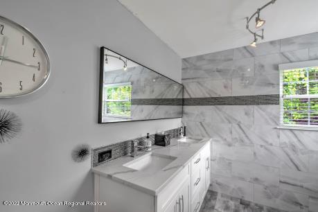 335 Buckalew Road Freehold, NJ 07728 - Photo 17 of 38 a bathroom with a sink vanity and a mirror