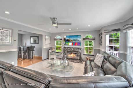 335 Buckalew Road Freehold, NJ 07728 - Photo 24 of 38 a living room with furniture and a large window