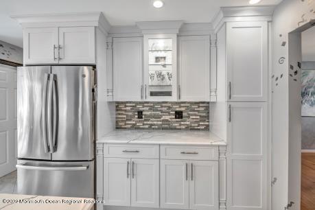 335 Buckalew Road Freehold, NJ 07728 - Photo 27 of 38 a kitchen with white cabinets and stainless steel appliances