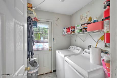 335 Buckalew Road Freehold, NJ 07728 - Photo 32 of 38 a utility room with dryer and washer