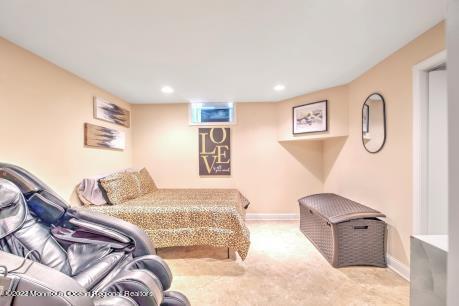 335 Buckalew Road Freehold, NJ 07728 - Photo 36 of 38 a bedroom with a bed and couch
