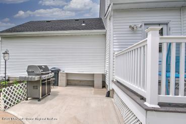 335 Buckalew Road Freehold, NJ 07728 - Photo 4 of 38 a view of a balcony with furniture and floor to ceiling window