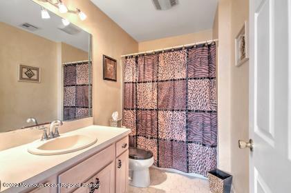 335 Buckalew Road Freehold, NJ 07728 - Photo 6 of 38 a bathroom with a sink toilet and shower