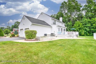 335 Buckalew Road Freehold, NJ 07728 - Photo 8 of 38 a view of house with backyard and garden