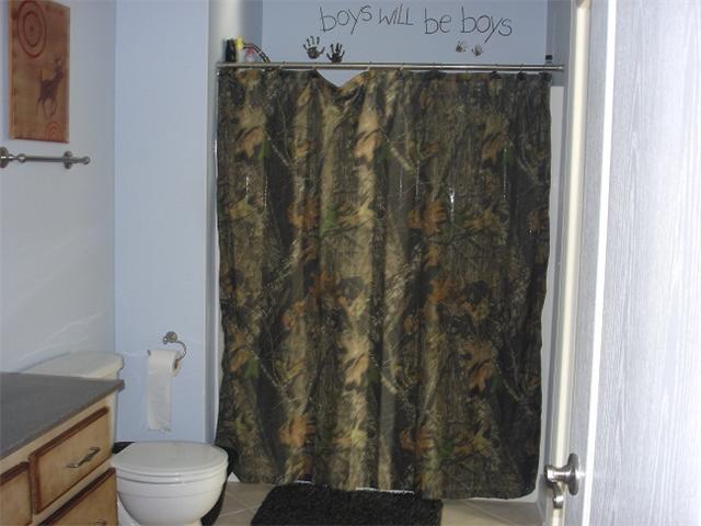 2564 Lanning Road Lawrenceburg, TN 38464 - Photo 13 of 20 a bathroom with a toilet and a shower