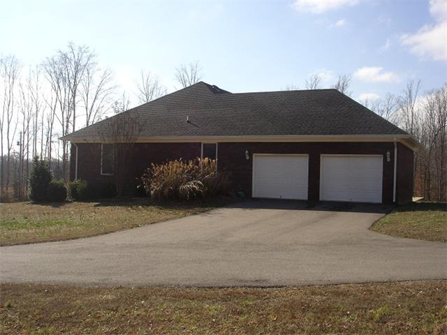 2564 Lanning Road Lawrenceburg, TN 38464 - Photo 4 of 20 a front view of a house with a yard and garage
