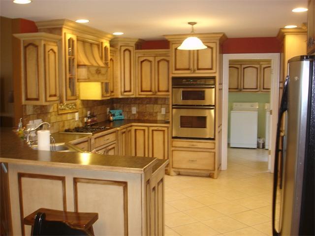 2564 Lanning Road Lawrenceburg, TN 38464 - Photo 7 of 20 a kitchen with stainless steel appliances granite countertop a sink and cabinets