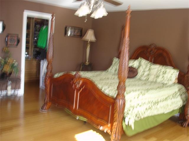 2564 Lanning Road Lawrenceburg, TN 38464 - Photo 9 of 20 a bedroom with bed and a chandelier