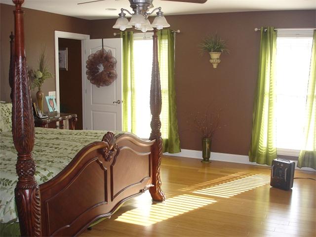 2564 Lanning Road Lawrenceburg, TN 38464 - Photo 10 of 20 a spacious bedroom with a bed and a chandelier