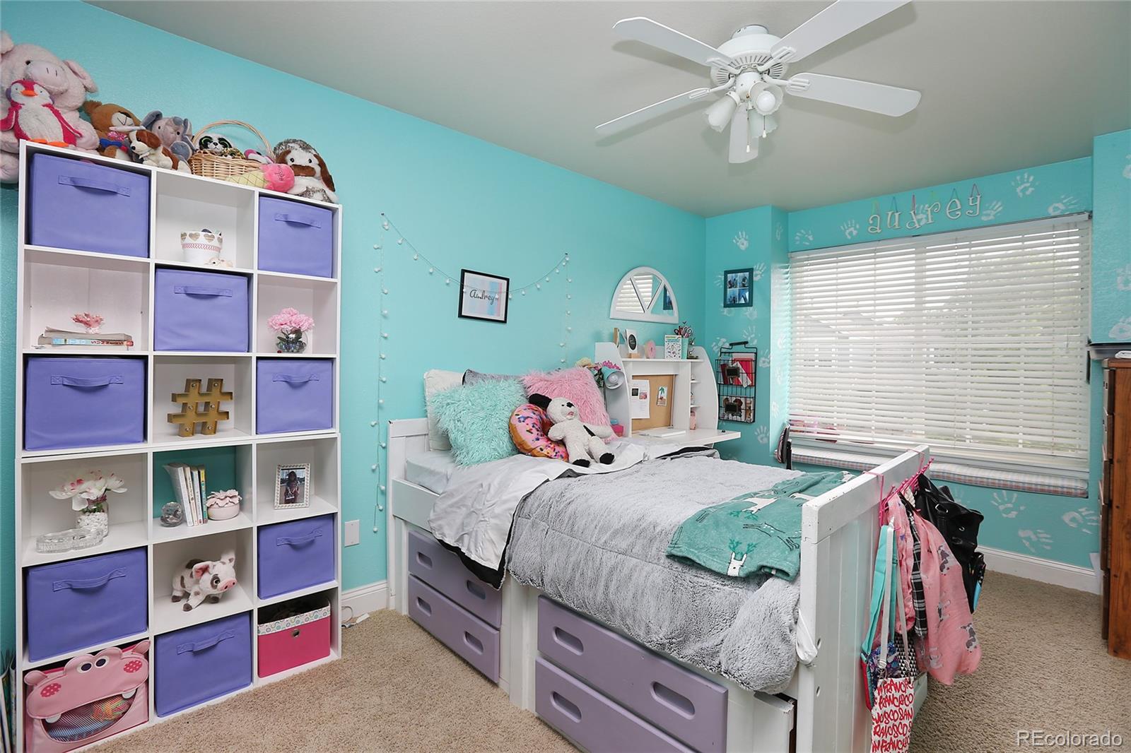 9764 Spring Hill Street Highlands Ranch, CO 80129 - Photo 22 of 32 a bedroom with a bed and dresser