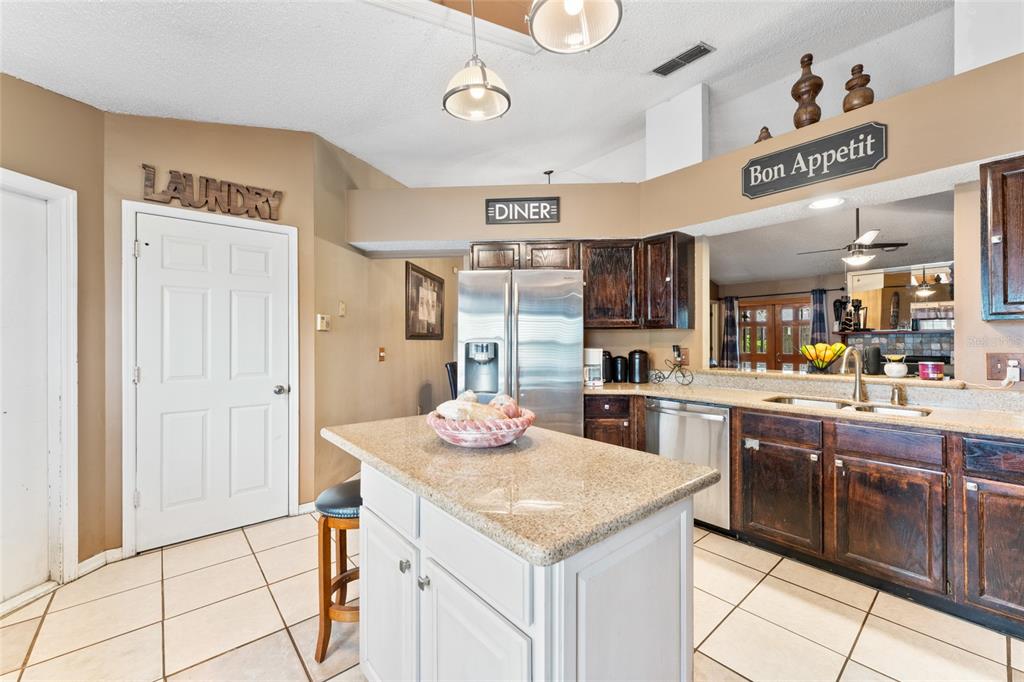 9083 Sable Ridge Court Jacksonville, FL 32244 - Photo 12 of 38 a kitchen with stainless steel appliances granite countertop a sink and cabinets