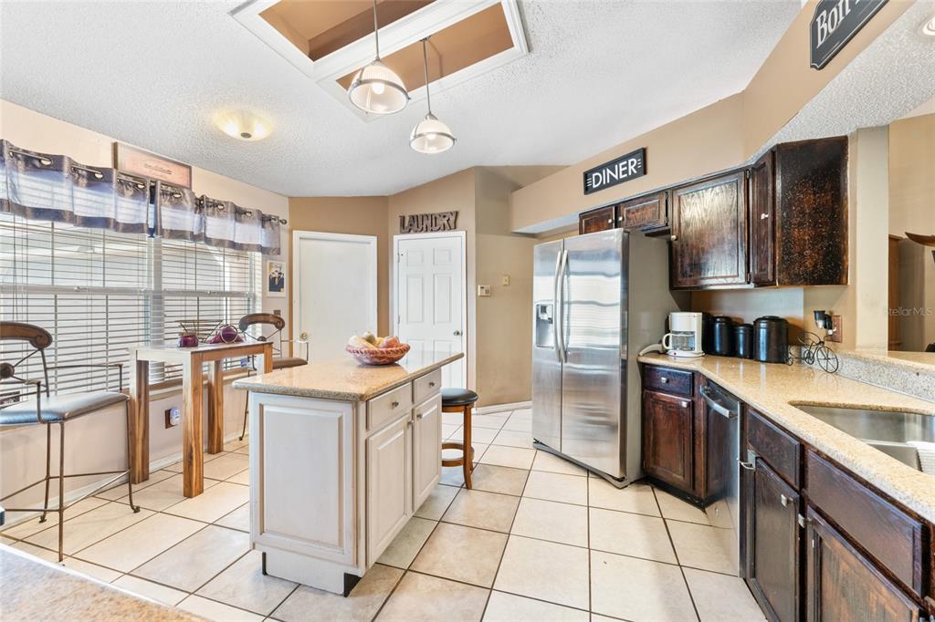 9083 Sable Ridge Court Jacksonville, FL 32244 - Photo 13 of 38 a kitchen with stainless steel appliances granite countertop a sink and cabinets