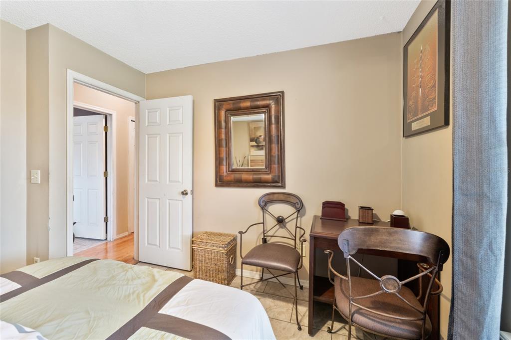 9083 Sable Ridge Court Jacksonville, FL 32244 - Photo 21 of 38 a bedroom with a bed and a table in it