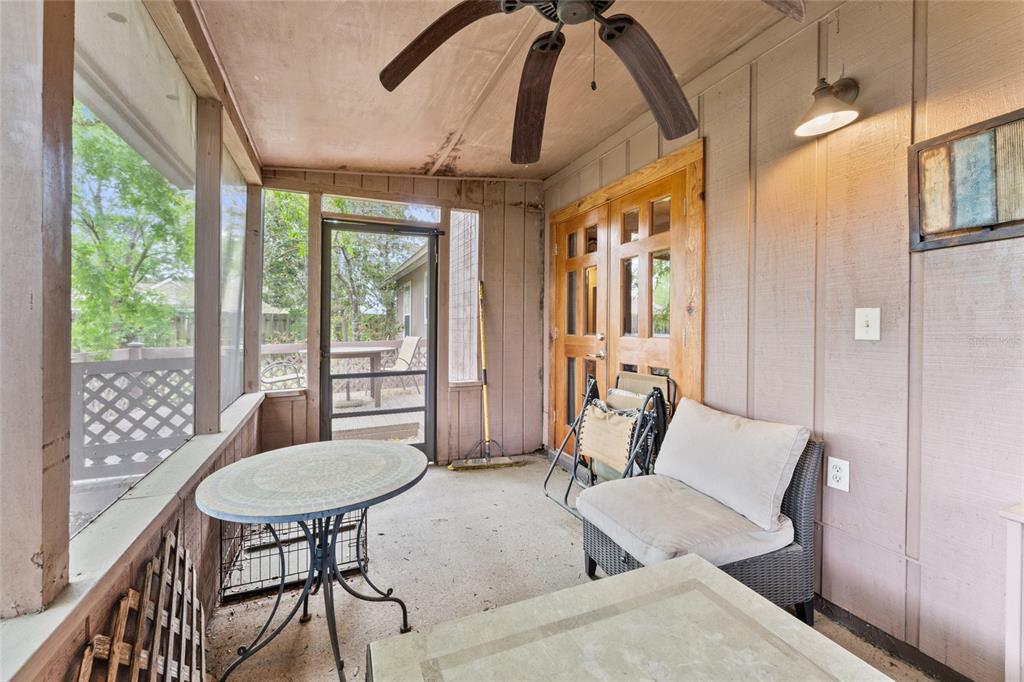 9083 Sable Ridge Court Jacksonville, FL 32244 - Photo 29 of 38 a living room with furniture and a floor to ceiling window