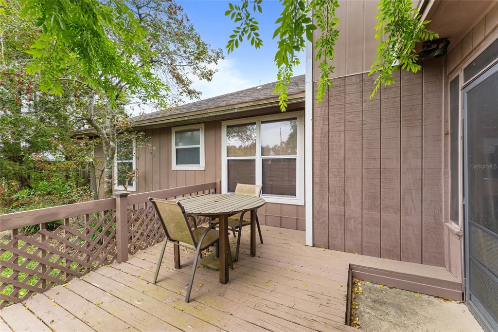 9083 Sable Ridge Court Jacksonville, FL 32244 - Photo 30 of 38 a view of backyard with a deck and wooden floor
