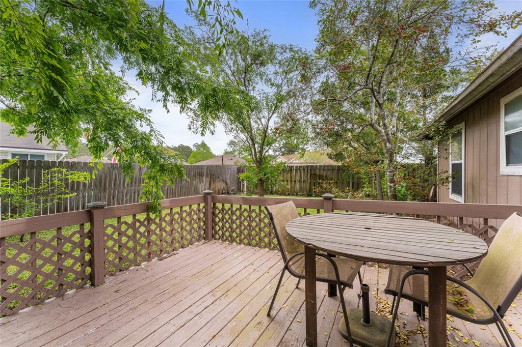 9083 Sable Ridge Court Jacksonville, FL 32244 - Photo 31 of 38 a view of a wooden deck with furniture