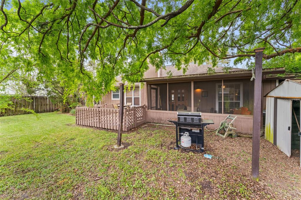 9083 Sable Ridge Court Jacksonville, FL 32244 - Photo 32 of 38 a view of a house with backyard sitting area and garden