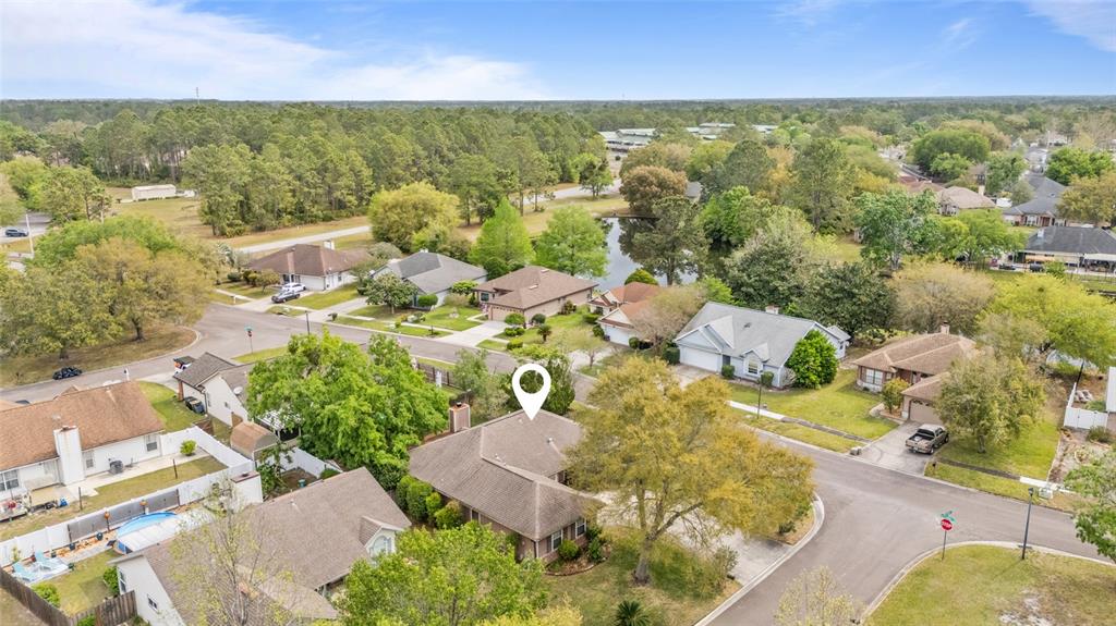 9083 Sable Ridge Court Jacksonville, FL 32244 - Photo 37 of 38 an aerial view of residential houses with outdoor space