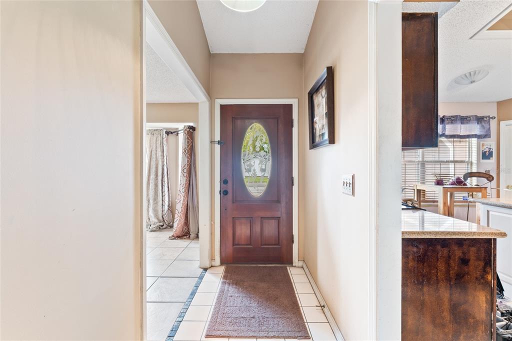 9083 Sable Ridge Court Jacksonville, FL 32244 - Photo 5 of 38 a view of an entryway with wooden floor