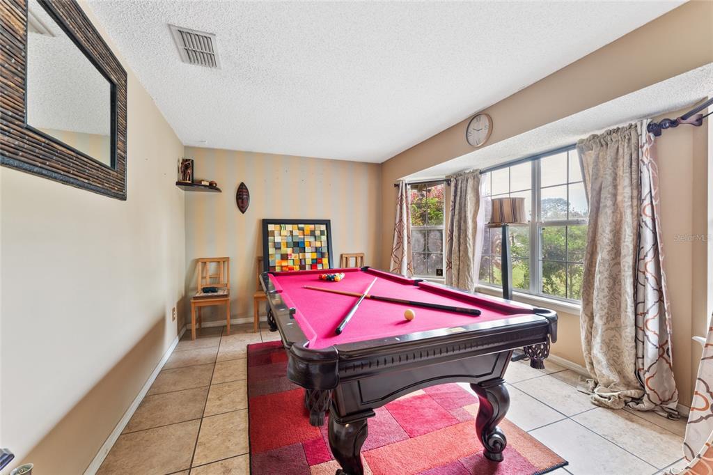 9083 Sable Ridge Court Jacksonville, FL 32244 - Photo 7 of 38 a patio with a table and chairs