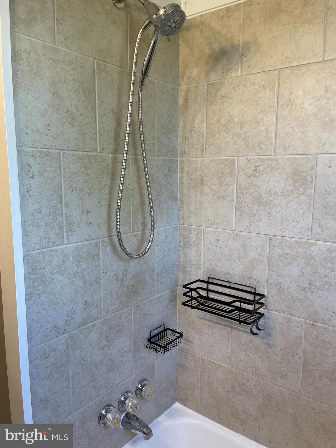 1067 North Mildred Street Ranson, WV 25438 - Photo 21 of 38 a bathroom with a shower