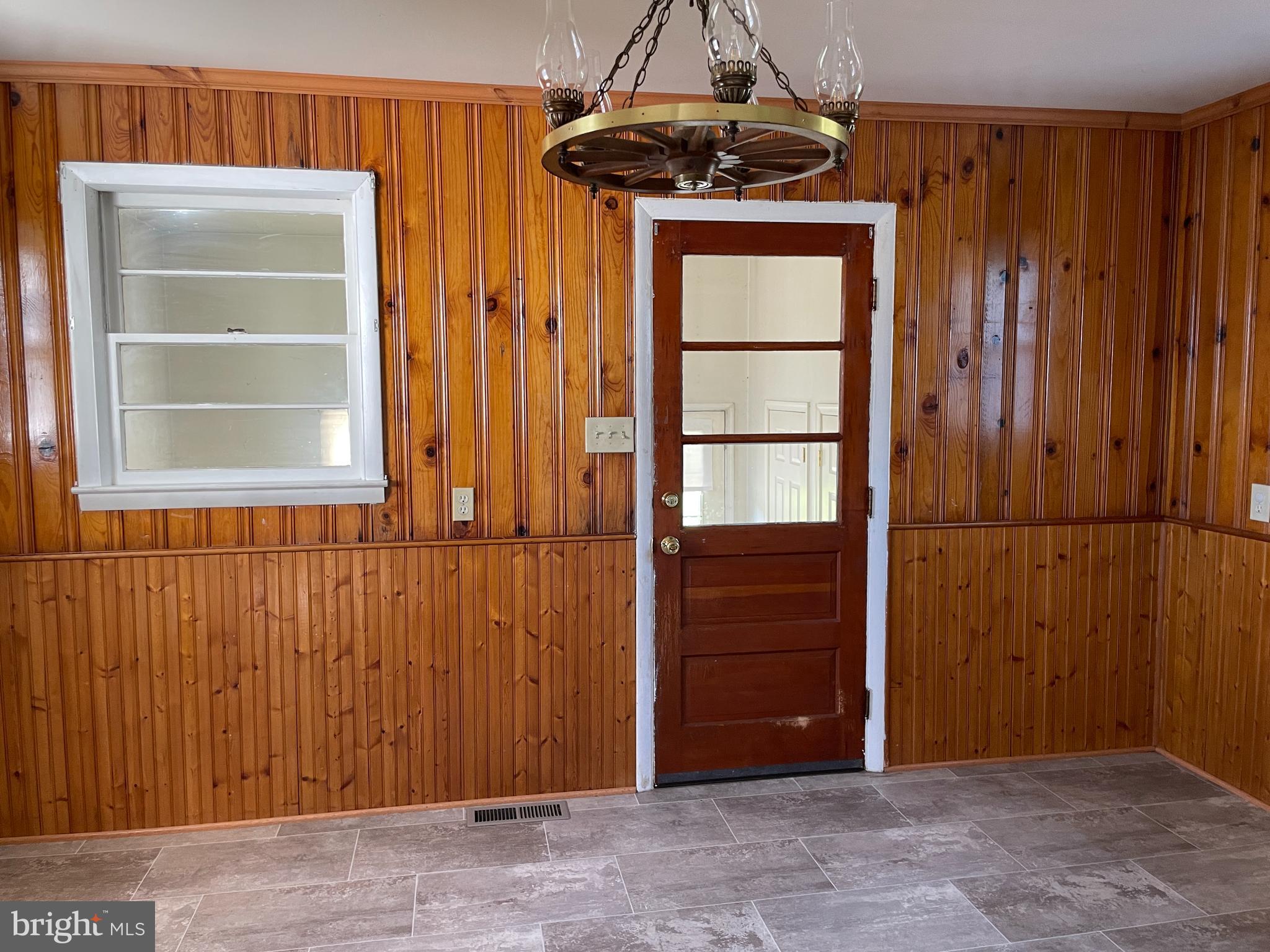1067 North Mildred Street Ranson, WV 25438 - Photo 27 of 38 an empty room with windows cabinet and window