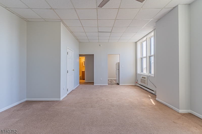 110 Cornelia Street, Unit 3 Boonton, NJ 07005 - Photo 2 of 14 an empty room with windows