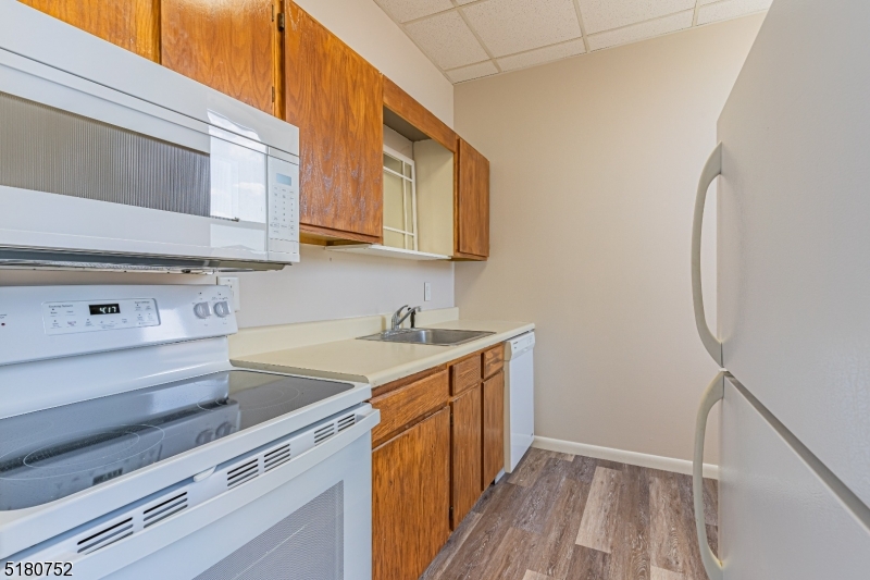 110 Cornelia Street, Unit 3 Boonton, NJ 07005 - Photo 5 of 14 a kitchen with a sink stove and microwave