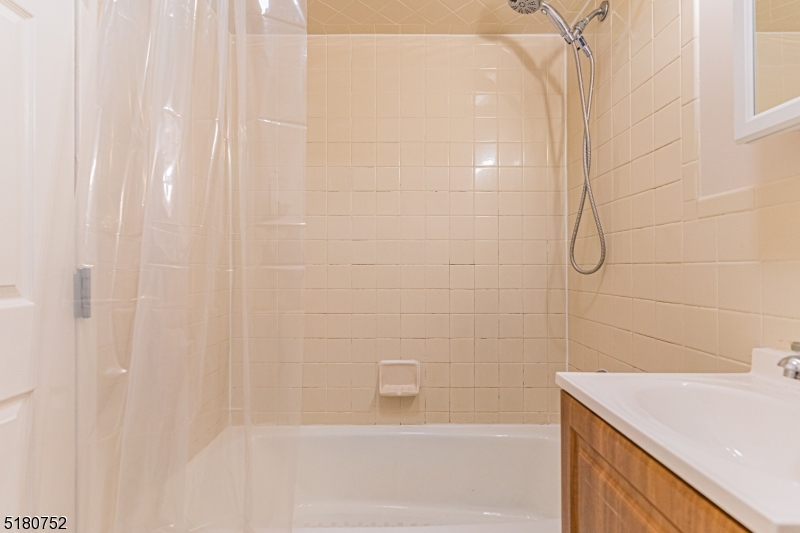 110 Cornelia Street, Unit 3 Boonton, NJ 07005 - Photo 9 of 14 a bathroom with a shower and a sink