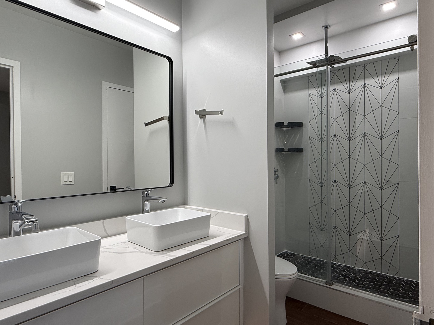 Undisclosed Address Chicago, IL 60657 - Photo 12 of 15 a bathroom with a sink and a mirror