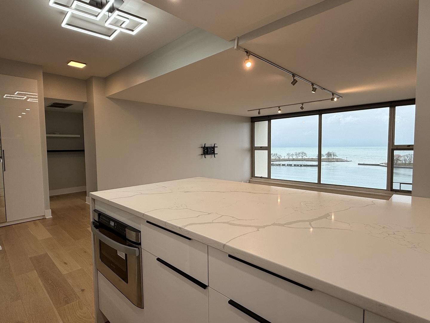 Undisclosed Address Chicago, IL 60657 - Photo 4 of 15 a room with a bed and a large window