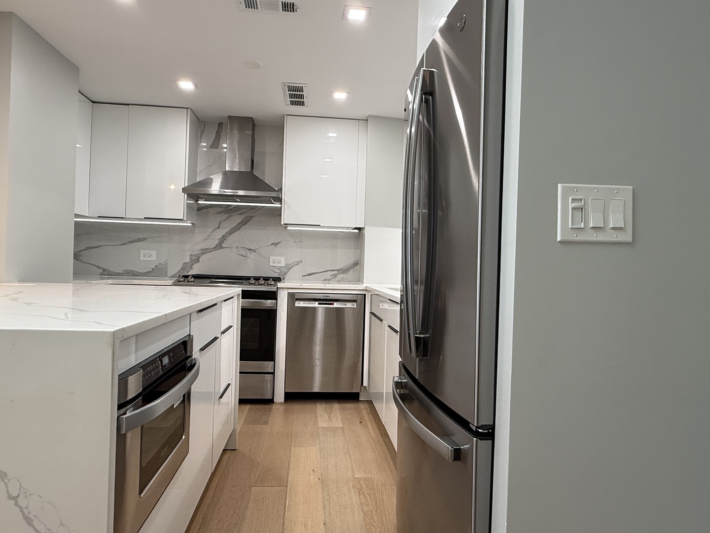 Undisclosed Address Chicago, IL 60657 - Photo 6 of 15 a kitchen with stainless steel appliances granite countertop a stove a refrigerator and a sink