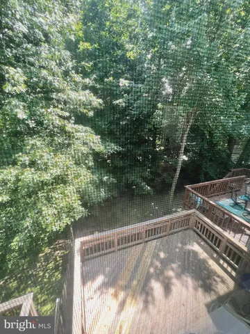 an empty room with a window and fireplace
