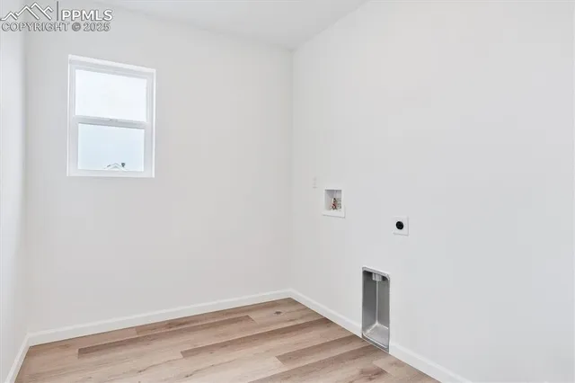 a view of a small space with wooden floor