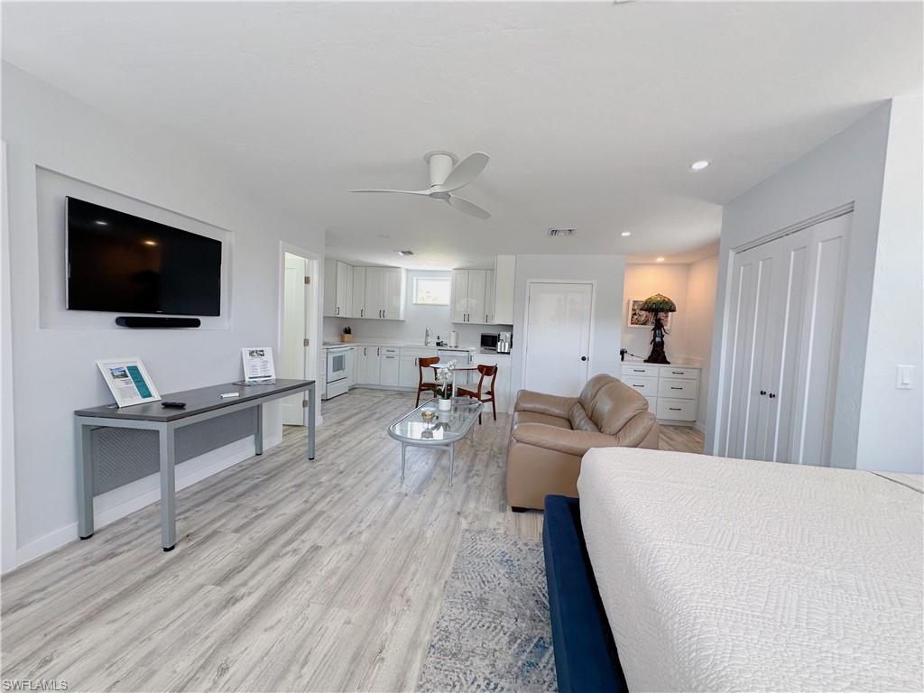 1308 Rosemary Lane Naples, FL 34103 - Photo 18 of 27 a living room with furniture and a flat screen tv