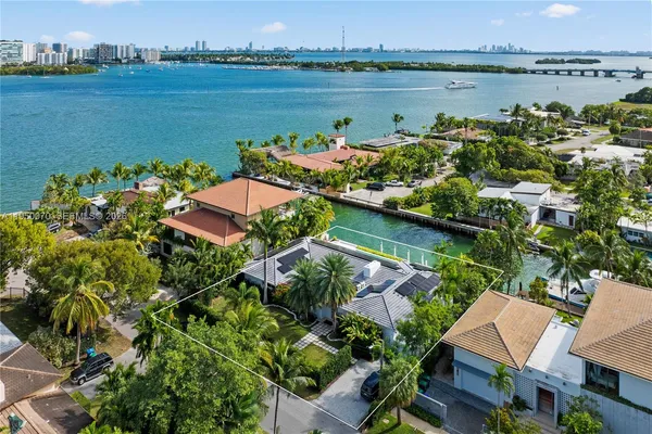an aerial view of a house with a lake view