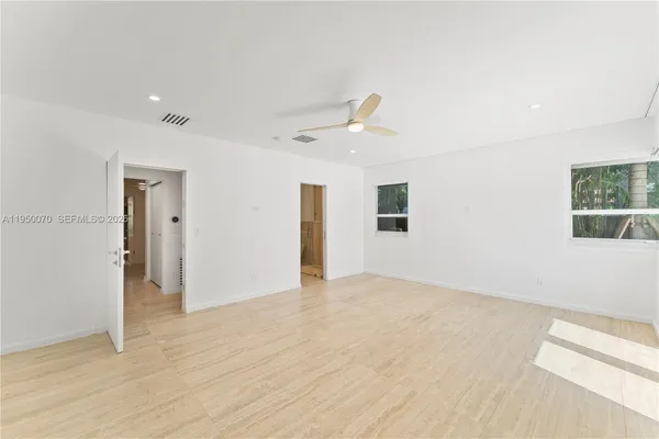 a bathroom with a toilet and shower
