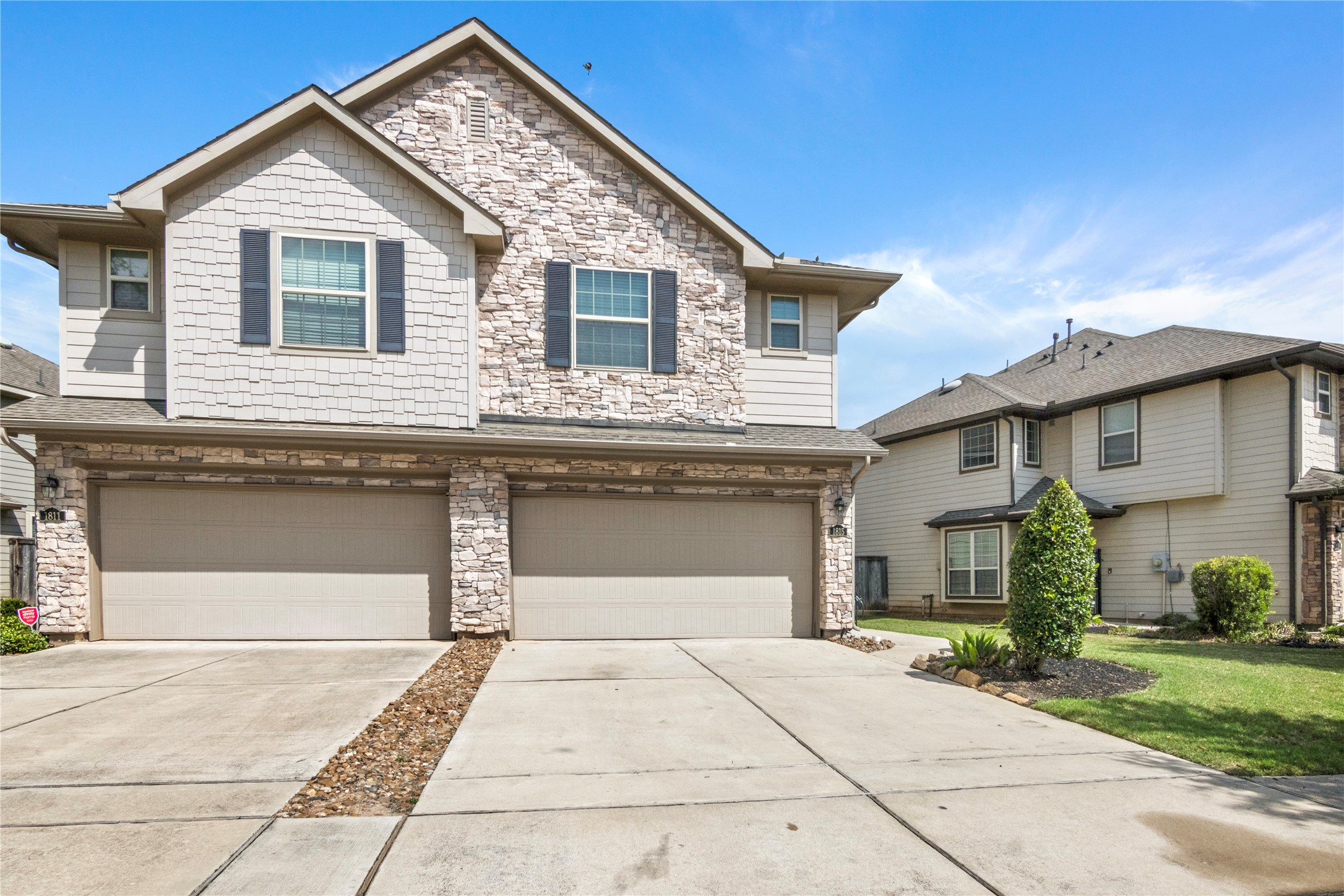 1815 Ryon Falls Drive Richmond, TX 77469 - Photo 2 of 24 a front view of a house with a yard and a garage