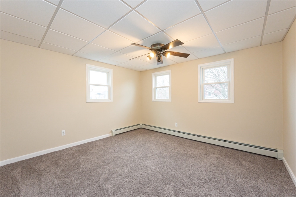 29 Mill Street, Unit B Dracut, MA 01826 - Photo 11 of 37 a view of an empty room with a window