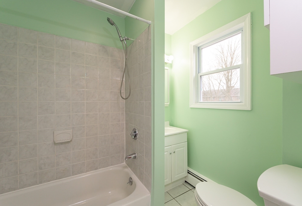 29 Mill Street, Unit B Dracut, MA 01826 - Photo 13 of 37 a bathroom with a toilet and shower